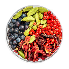 Winter spices isolated. Cardamon, pink pepper, Juniper berries and hibiscus flower spices on white background, top view. Flat lay.