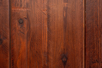 Wooden plank with saw marks and dark knots varnished in a reddish tone. Vector wood texture background