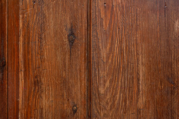 Wood planks with saw marks and dark knots varnished in a dark reddish tone. Vector wood texture background