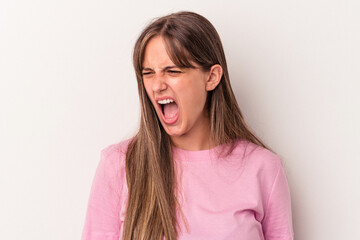 Obraz premium Young caucasian woman isolated on white background shouting very angry, rage concept, frustrated.