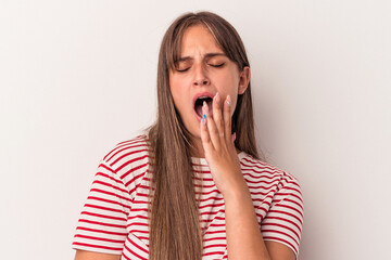 Young caucasian woman isolated on white background yawning showing a tired gesture covering mouth with hand.