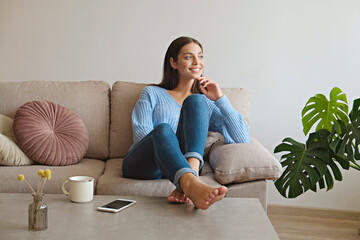Kick back and relax concept. Young beautiful brunette woman with blissful facial expression alone...