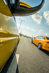 Yellow taxis driving on an urban highway