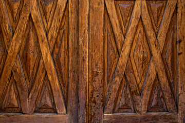 Wooden panels of a vintage door with scratches and varnish in poor condition. Vector wood texture background