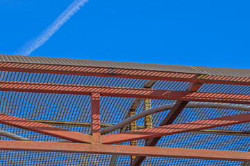 A fragment of a rusting metal roof on a sunny autumn day close-up