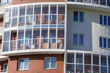 Fragment of the facade of an apartment building on a sunny autumn day