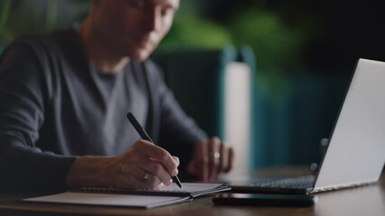Hispanic latin man college student using laptop computer watching distance online learning seminar class, remote university webinar or having virtual classroom meeting in university creative space. - Powered by Adobe