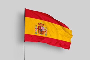 Spain flag isolated on the blue sky background. close up waving flag of Spain. flag symbols of Spain. Concept of Spain.