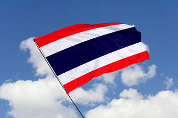 Thailand flag isolated on the blue sky background. close up waving flag of Thailand. flag symbols of Thailand. Concept of Thailand.