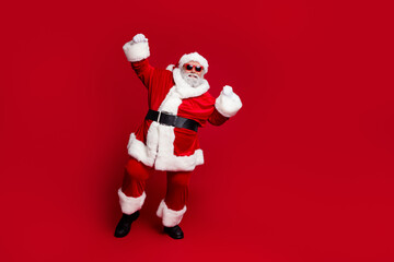 Full length body size view of attractive cheerful Santa dancing having fun rejoicing good mood isolated over bright red color background