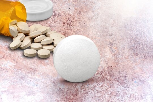 Collection of pill medication on table medical concept