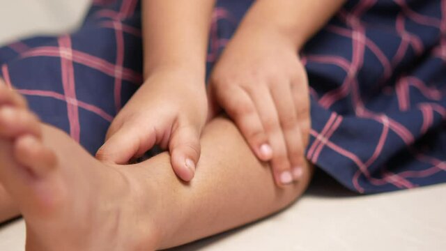 Child Girl Suffering Pain On Feet 