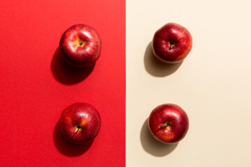 Many red apples on colored background, top view. Autumn pattern with fresh apple above view