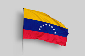Venezuela flag isolated on the blue sky background. close up waving flag of Venezuela. flag symbols of Venezuela. Concept of Venezuela.