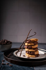 Double chocolate and vanilla cookies on a playful stack