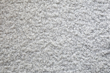 Karakul texture. Fabric background with gray curls