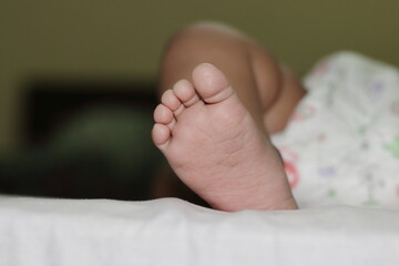 Foot photo of an indian small innocent newborn baby