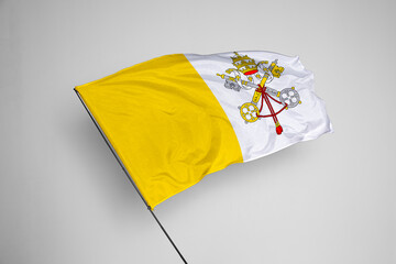 Vatican City flag isolated on white background. close up waving flag of Vatican City. flag symbols of Vatican City. Concept of Vatican City.