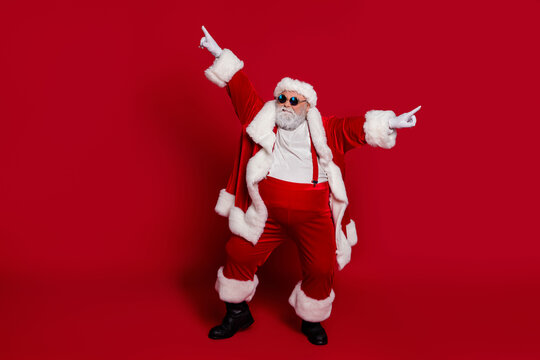 Photo of funky crazy carefree old man dance performance wear santa hat costume isolated red color background