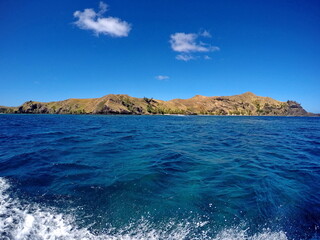 Clear blue water around an island in Fiji