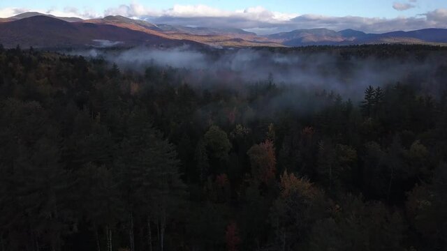 Sunrise in the mountains with mist. Evans Notch, New England.
