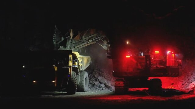 view of large mining vehicles at a mining quarry (China) (time-lapse)