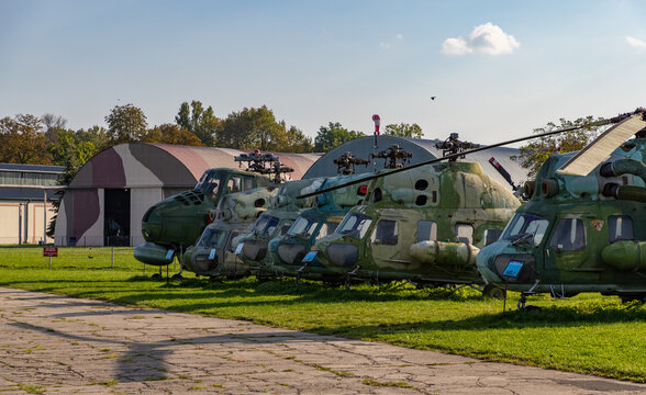 Kraków, Poland - October 2, 2021: A picture of a row of military helicopters on the grounds of the Polish Aviation Museum.