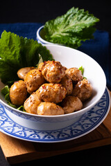 Food concept homemade Asian Meatballs with sweet and spicy soy sauce on wooden board with copy space