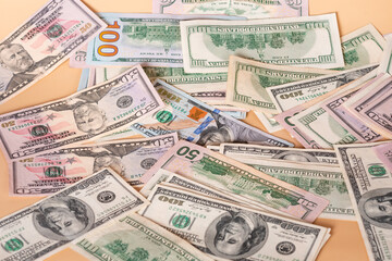 Dollars on a beige background. Financial savings and income.