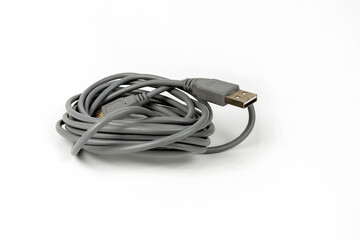 connecting cord for USB connectors of a personal computer coiled into a tight coil. copy space