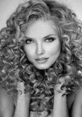 Beautiful blonde woman. Healthy Long Blond Hair. Curly Hair. Blond. Permed Hair. Afro curls. Long blond Hair.  Beauty Model Girl with Luxurious Hair.