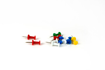 different color pushpins close-up. isolated on white background