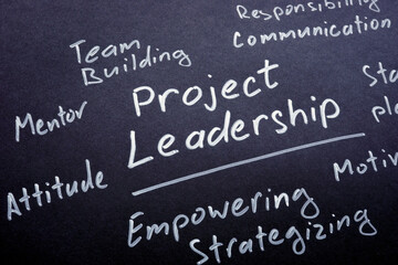 Project leadership phrase written on the black paper.