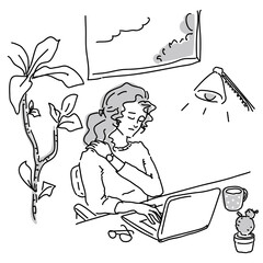 ノートパソコンで仕事をしているカジュアルファッションの女性
