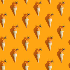 small pumpkin and spider in a cup of ice cream