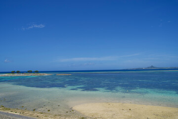 Fototapeta na wymiar The view of beach and Ie island in Okinawa.