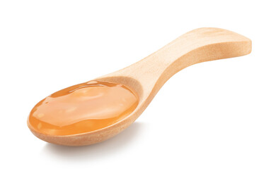 sauce sweet and sour in wooden spoon isolated on white