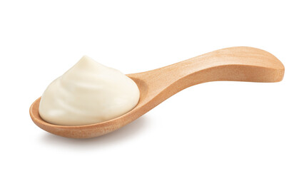 mayonnaise in a special wooden spoon for sauces isolated on white
