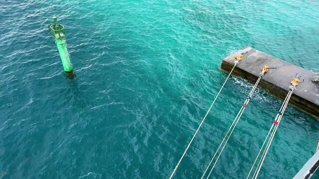 Cruise ship dock lines and splashing ocean  at  MSC Cruise Lines private island  Ocean Cay in the Bahamas.