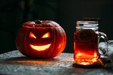 Naklejka premium pumpkin with candles, halloween holiday concept
