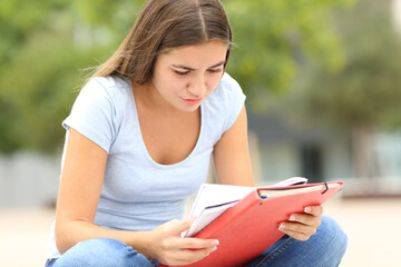 Student learning reading notes in a campus