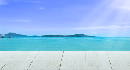 Fototapeta premium Beautiful wooden floor and blue background, sea water and sky.