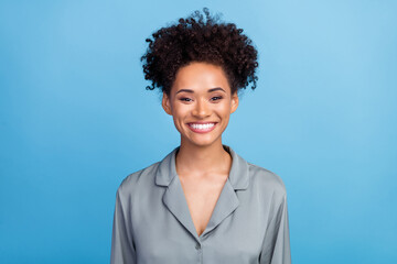 Photo of young cheerful black girl good mood awakening morning routine isolated over blue color...