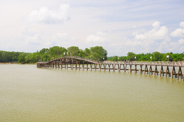 Fototapeta na wymiar Wooden Bridge at Nong Yai of Chumphon province, Southern of THAILAND