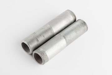Metal adapter of plumbing couplings on a white background. Close-up