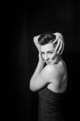 Black and white portrait of a beautiful woman with a short haircut mohawk emotions mood