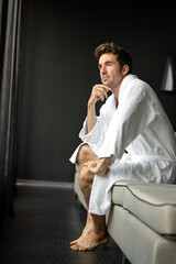 Handsome happy man relaxing enjoying spa treatment
