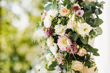 Fresh flower decoration of a wedding arch - pink and white fresh flowers. Fresh roses flower...
