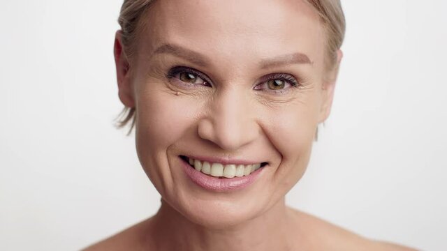 Anti-Aging Skincare. Beautiful Mature Woman With Wrinkles Near Eyes Looking At Camera