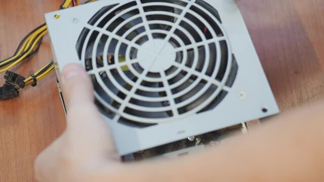 Assembling desktop computer power supplies. Close up shot